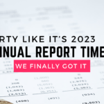 Background image is of a calculator and pen out of focus, and a spreadsheet. The caption is "Party like it's 2023, Annual Report time, we finally got it"